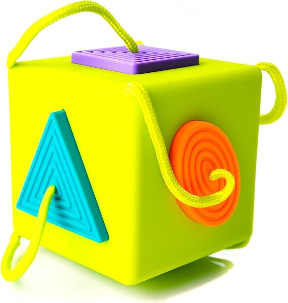 Fat Brain Toys OombeeCube, Toddler and Baby Toys 10 Months and Up, Travel-Friendly Shape Sorter with Tethered Shapes for Early Learning | Play cube with tethered silicone shapes. Shape-matching, fine motor skills, sensory learning. Nursery toy. Ages 10 months+.